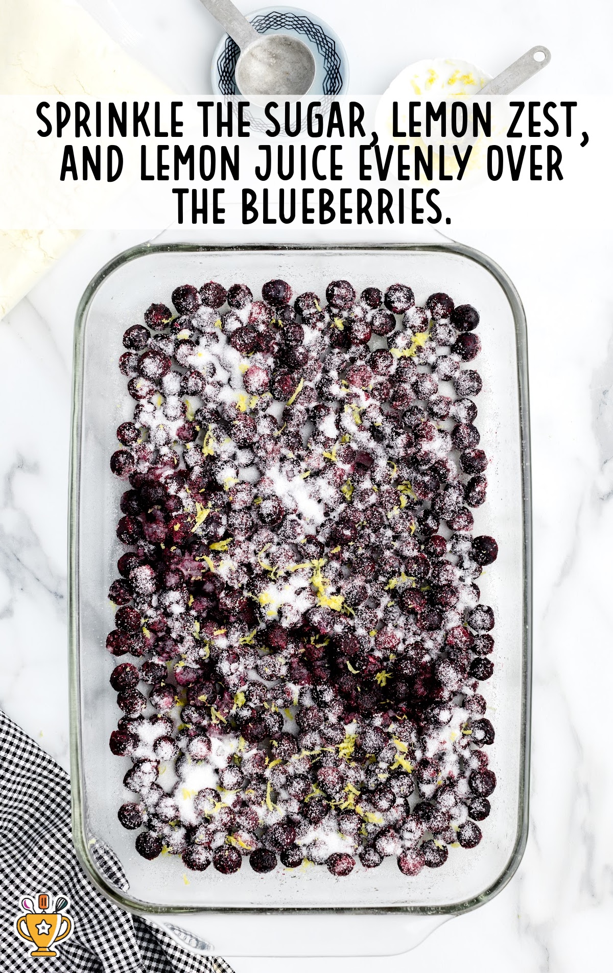 sugar, lemon zest and lemon juice over the blueberries in a baking dish