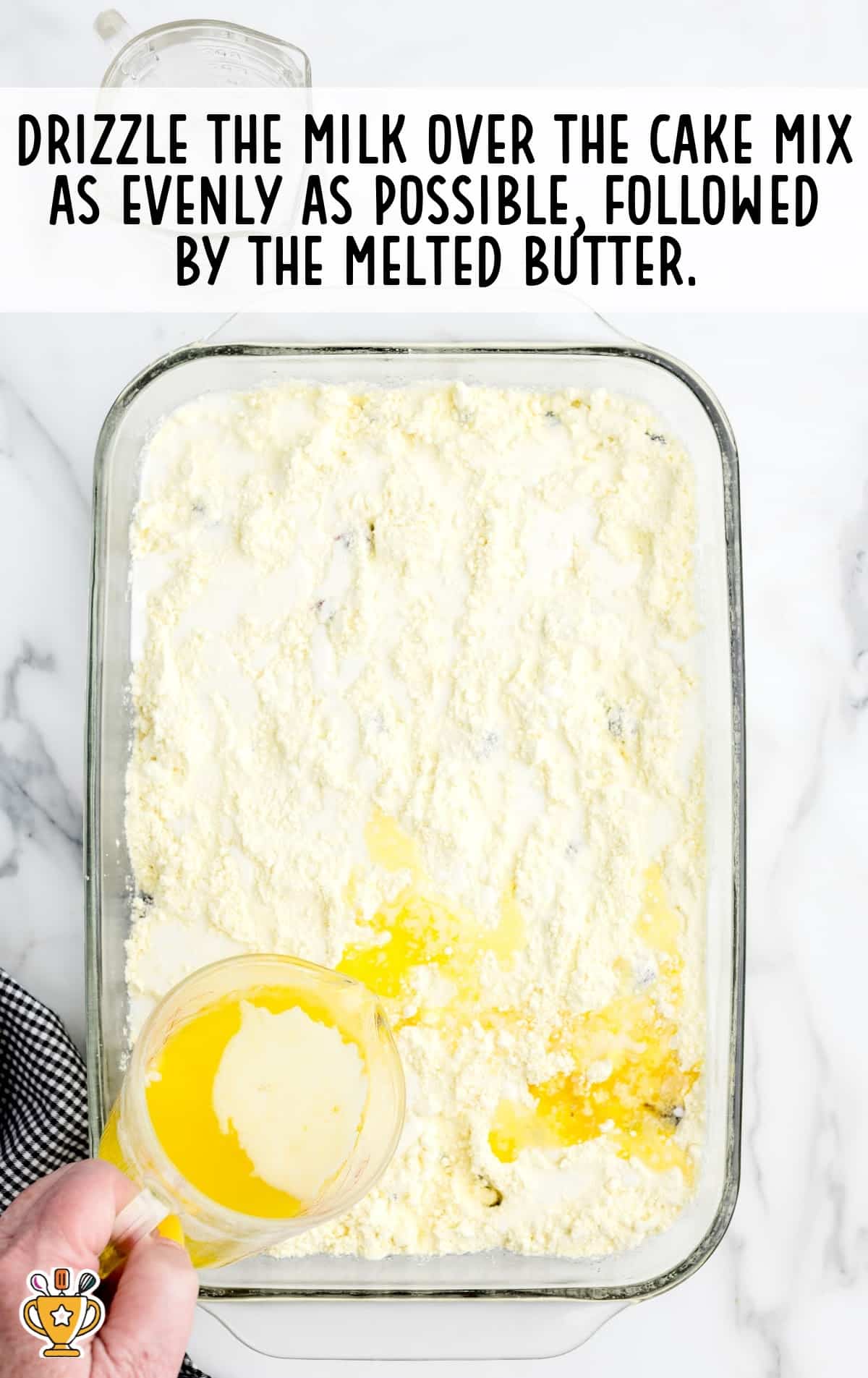 milk over cake mix in a baking dish