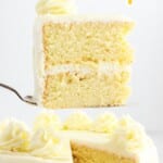 a spatula holding a piece of Lemon Cake and a Lemon Cake with a piece missing