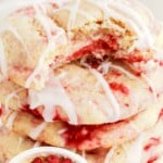 a stack of Lemon Raspberry Cookies and a bowl of Lemon Raspberry Cookies batter with raspberries in it