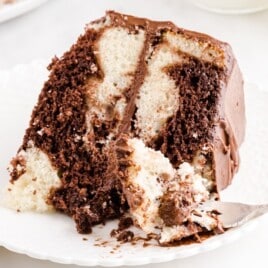 a piece of Marble Cake on a plate with a fork