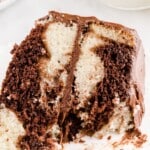 a piece of Marble Cake on a plate with a fork