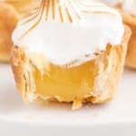 a Mini Lemon Meringue Pie with a bite on it