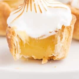 a Mini Lemon Meringue Pie with a bite on it
