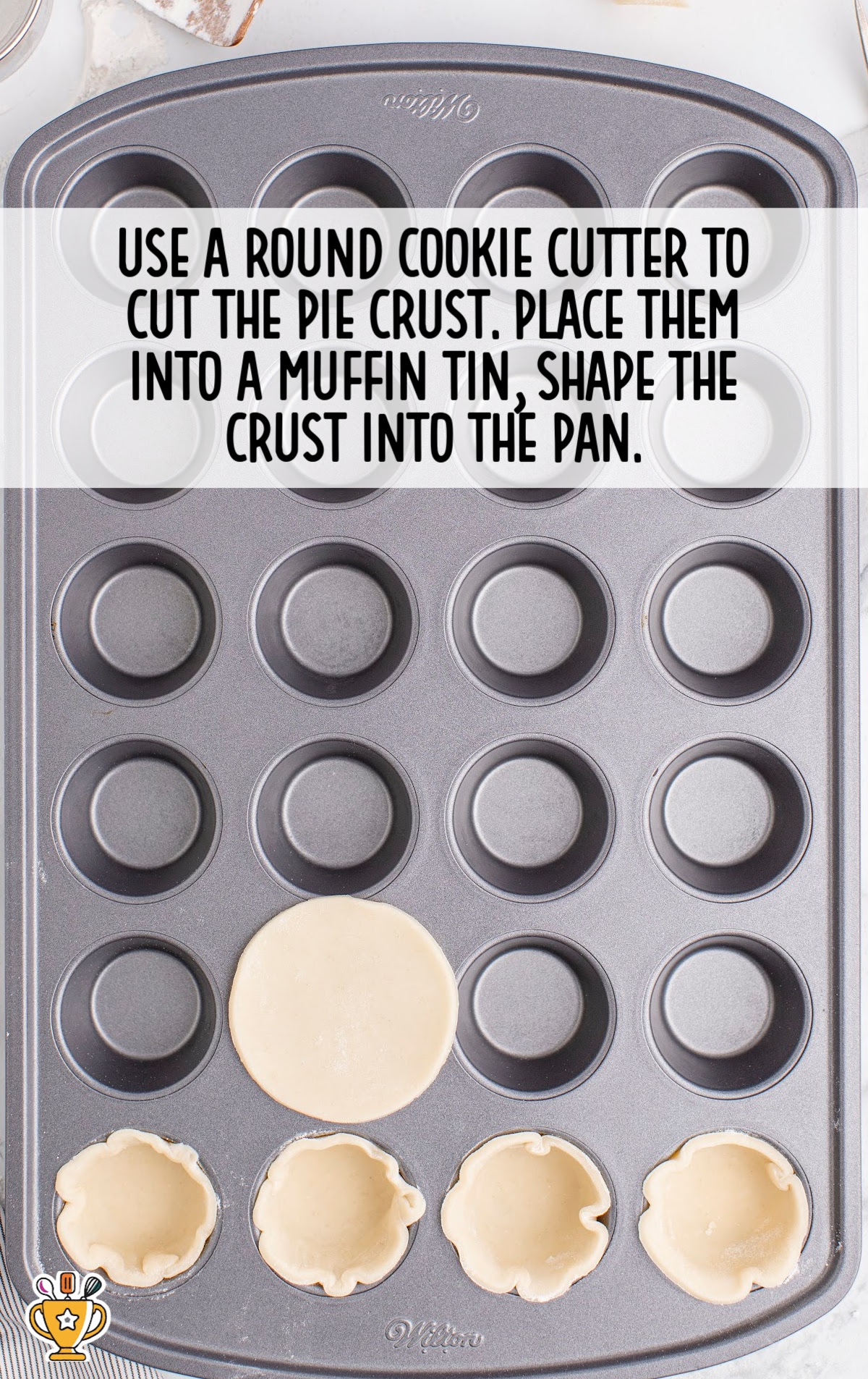 using a round cookie cutter to cut pie crust