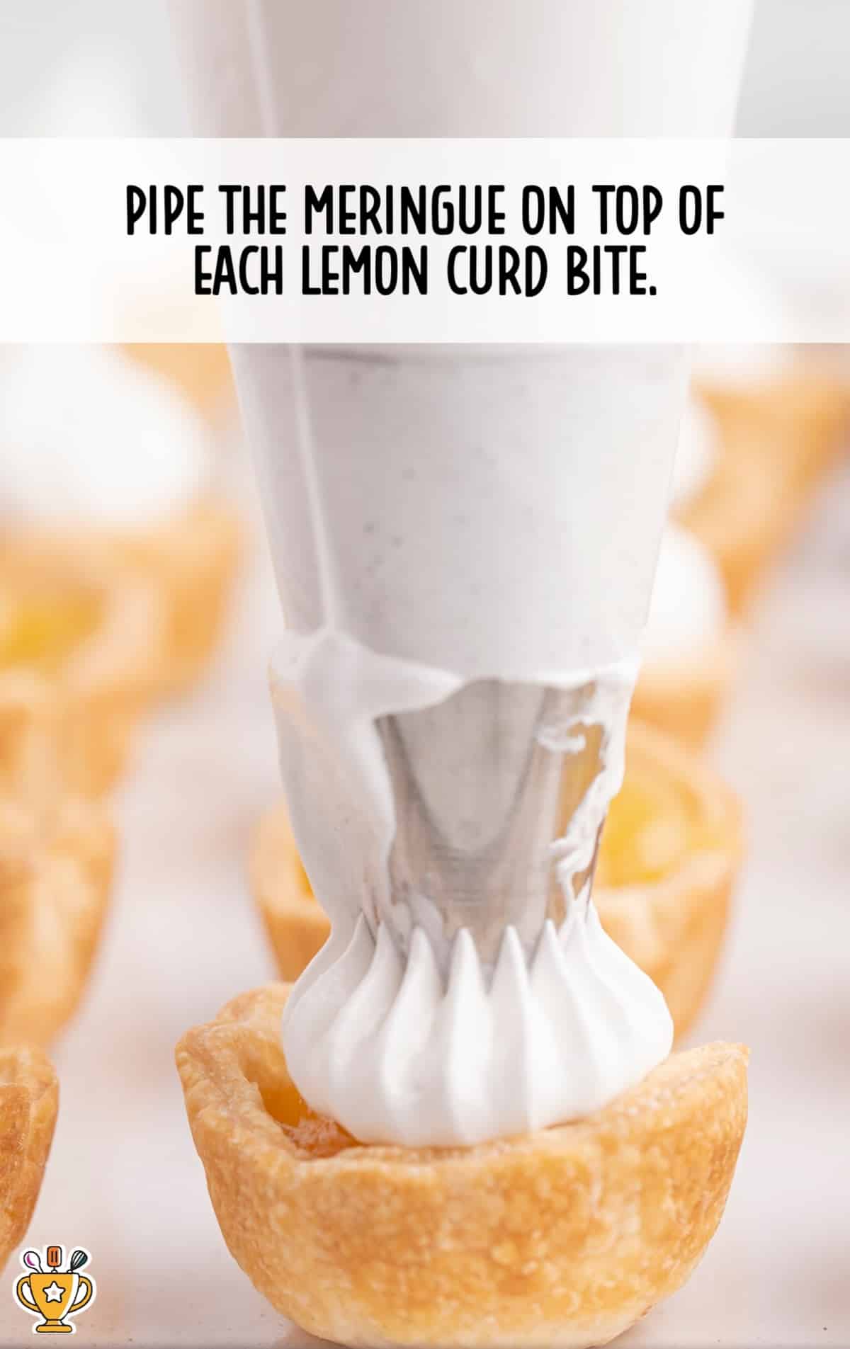 piping the meringue on top of each lemon curd bite