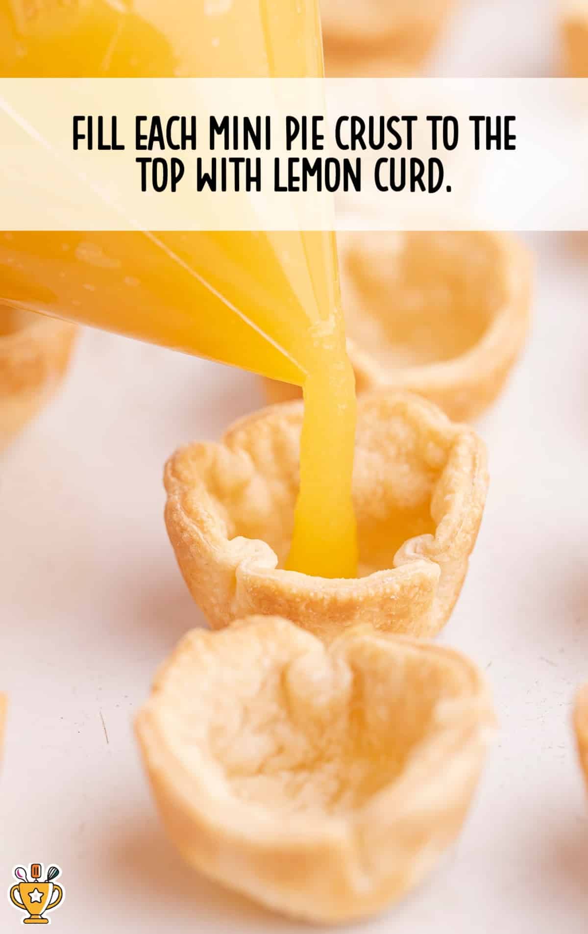 filling mini pie crust to the top with lemon curd