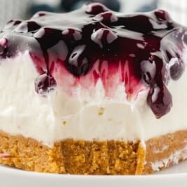 a piece of No Bake Blueberry Cheesecake on a white plate