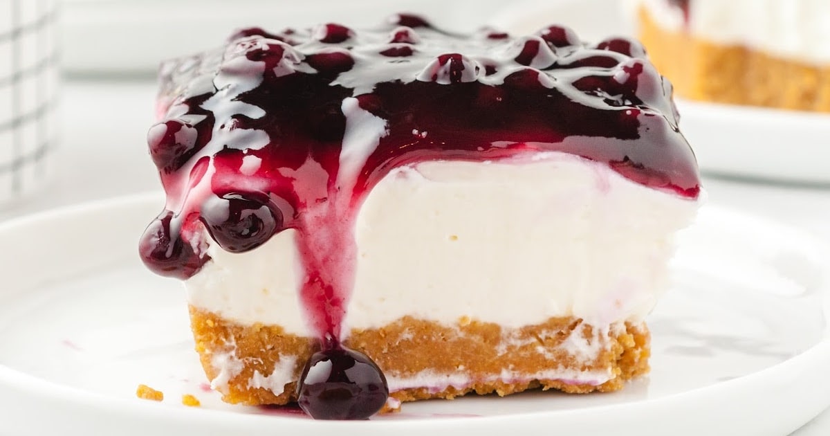 a piece of No Bake Blueberry Cheesecake on a white plate