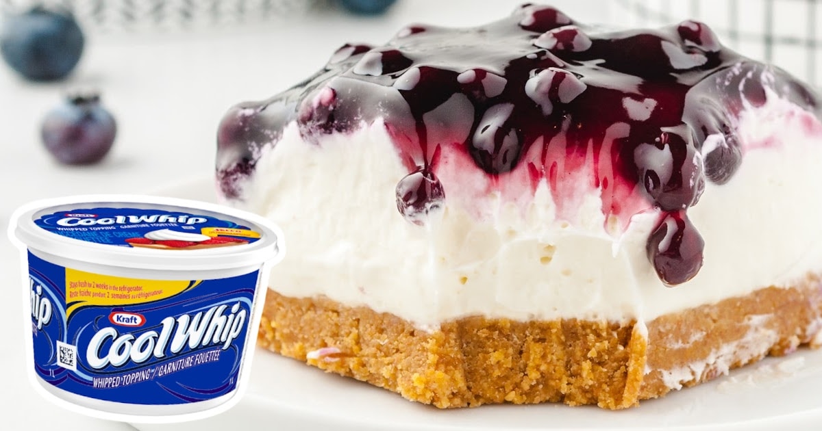 a piece of No Bake Blueberry Cheesecake with a jar of cool whip on the side