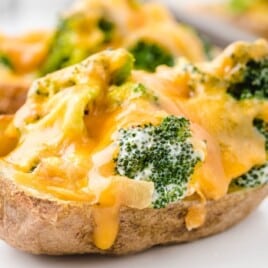 a close up photo of a Broccoli and Cheddar Potato Skin
