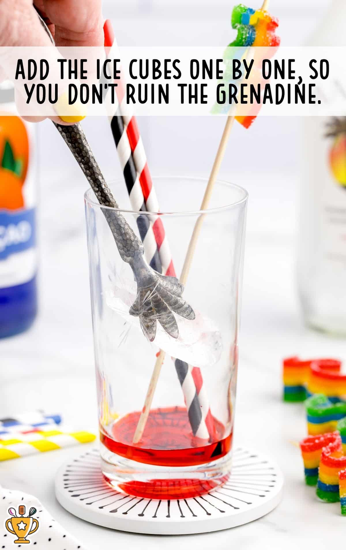 adding ice cubes in a glass
