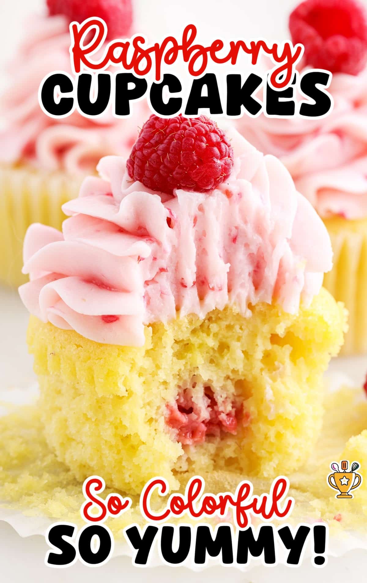 a Raspberry Cupcake with a bite on it