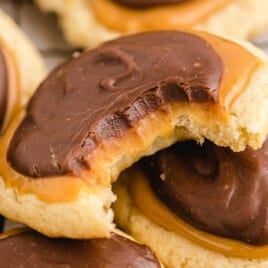 a bunch of Twix Cookies, one with a bite on it