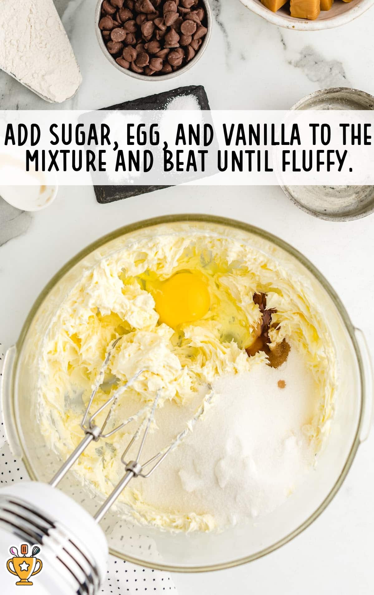 sugar, egg and vanilla added to the mixture in a bowl