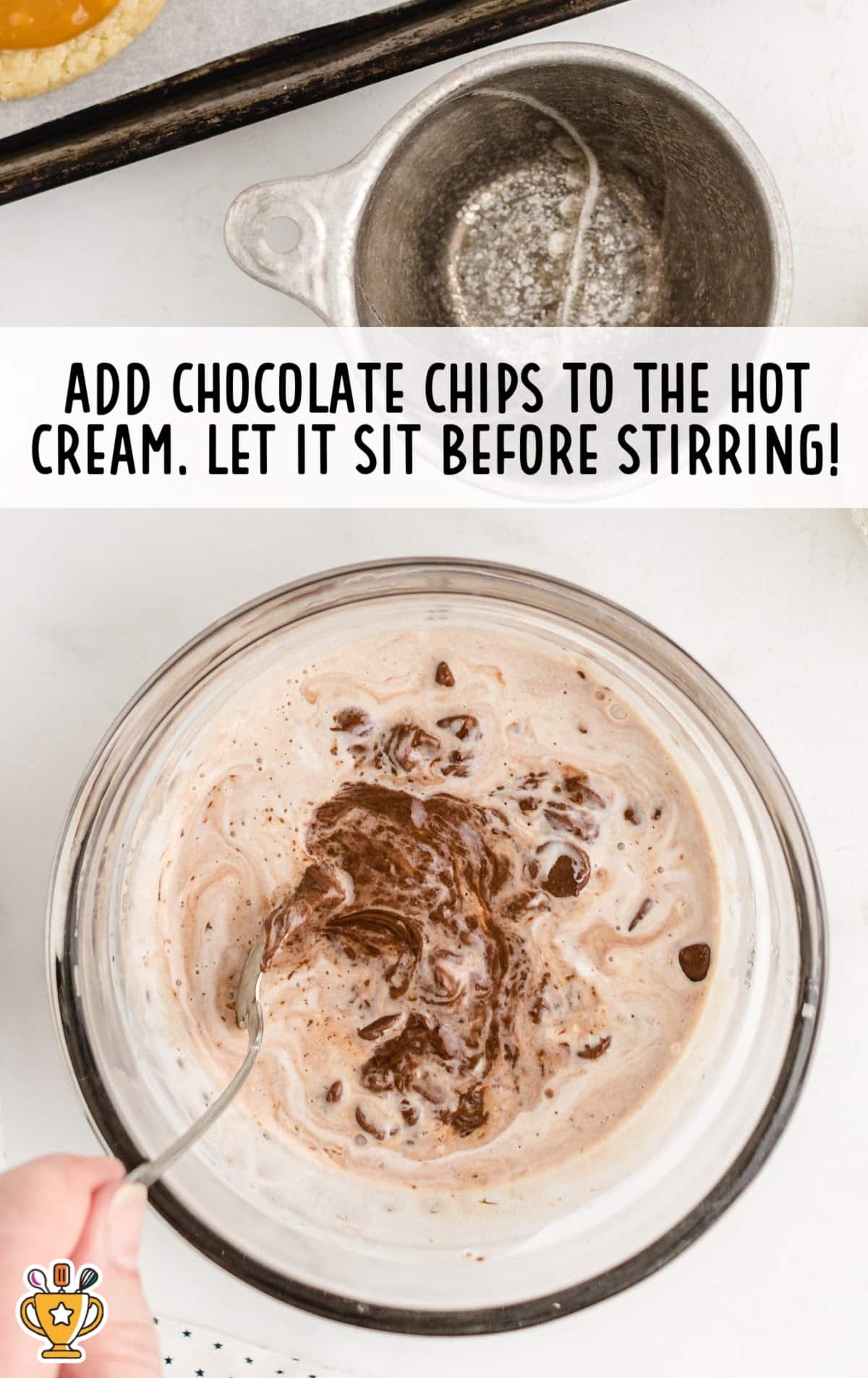 chocolate chips added to the hot cream in a bowl
