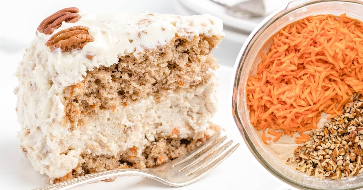 a piece of Carrot Cake Cheesecake on a plate with a fork