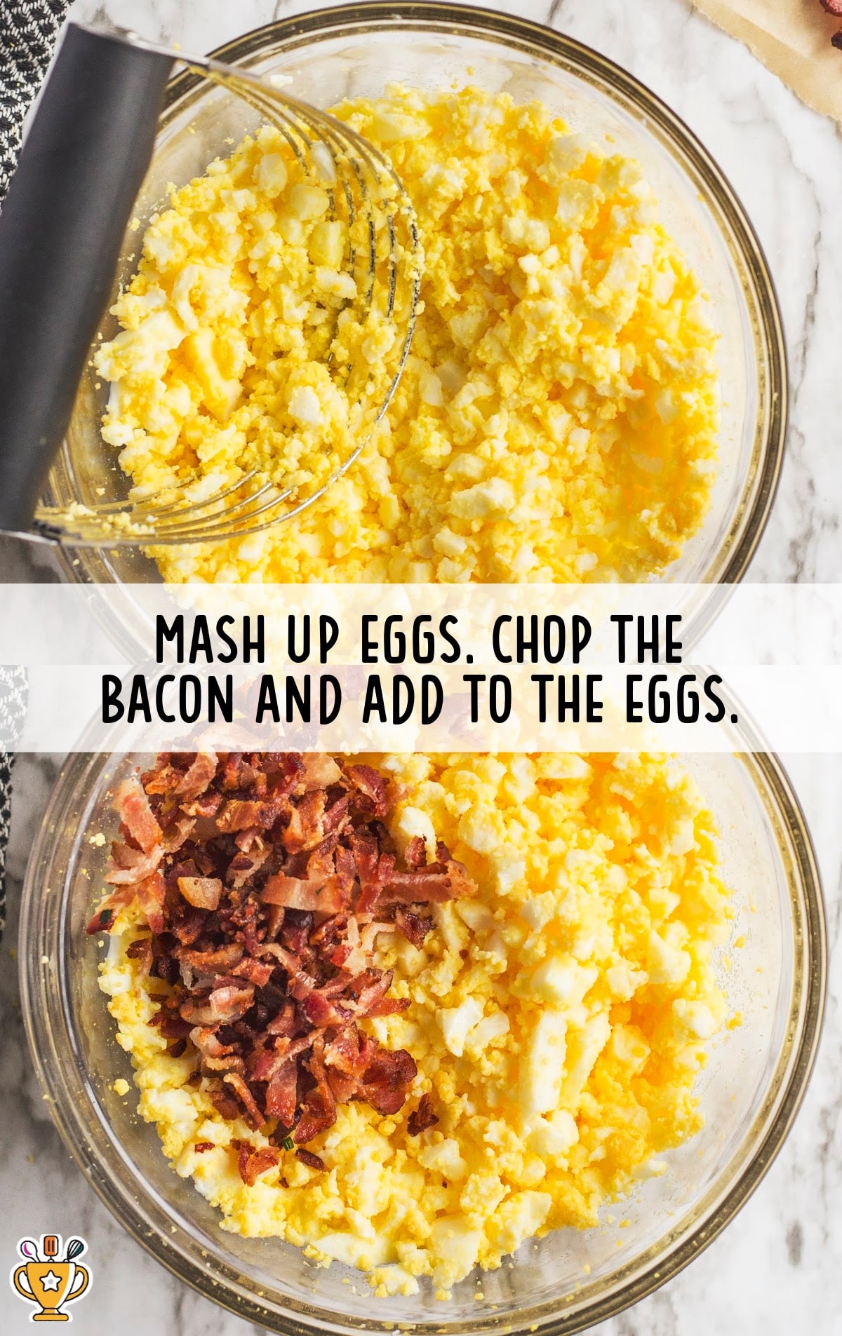 mashed up eggs in a bowl ,bacon added in