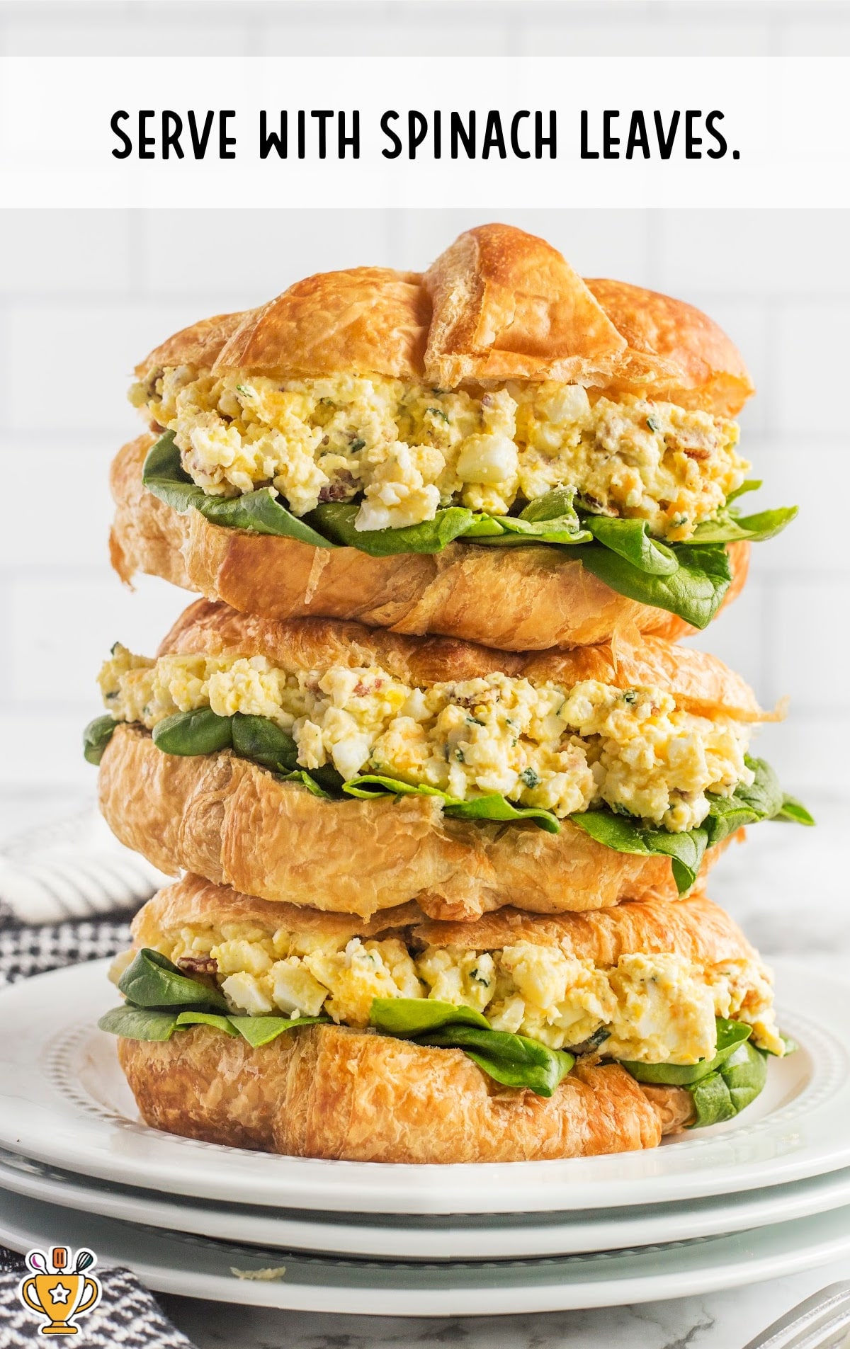 a stack of Egg Salad Sandwiches on plates