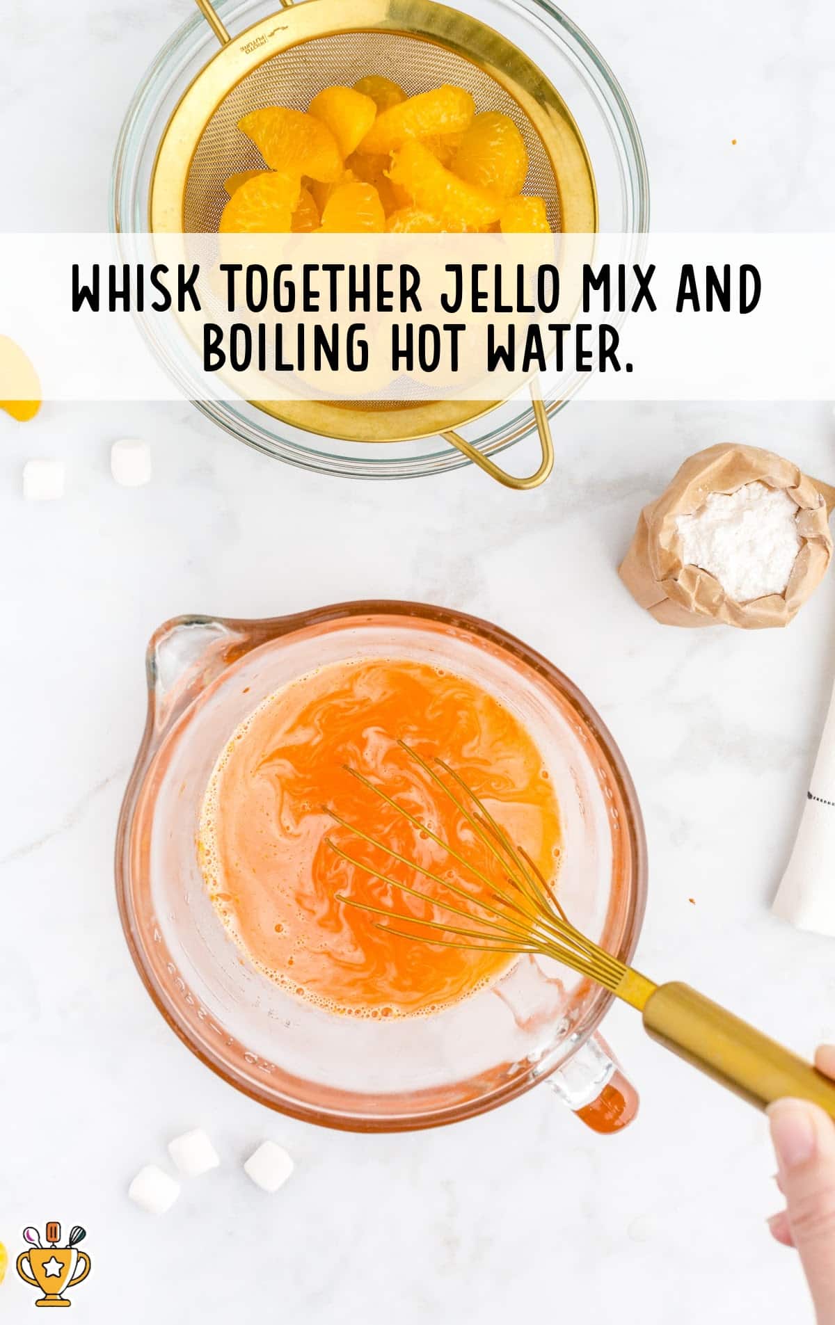 jello mix and boiling hot water mixed in a bowl