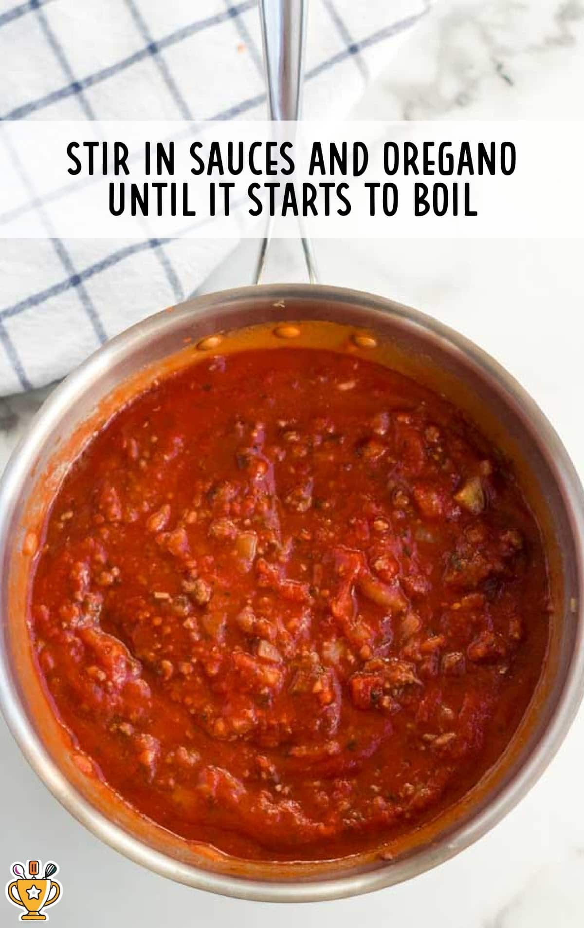stirring in sauce and oregano