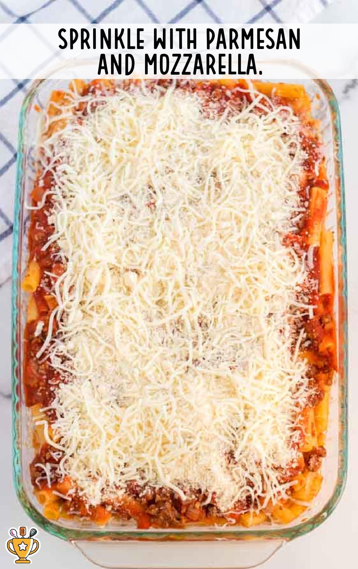 Baked Ziti sprinkled with parmesan and mozzarella