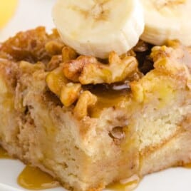 a piece of Banana Bread Pudding on a white plate