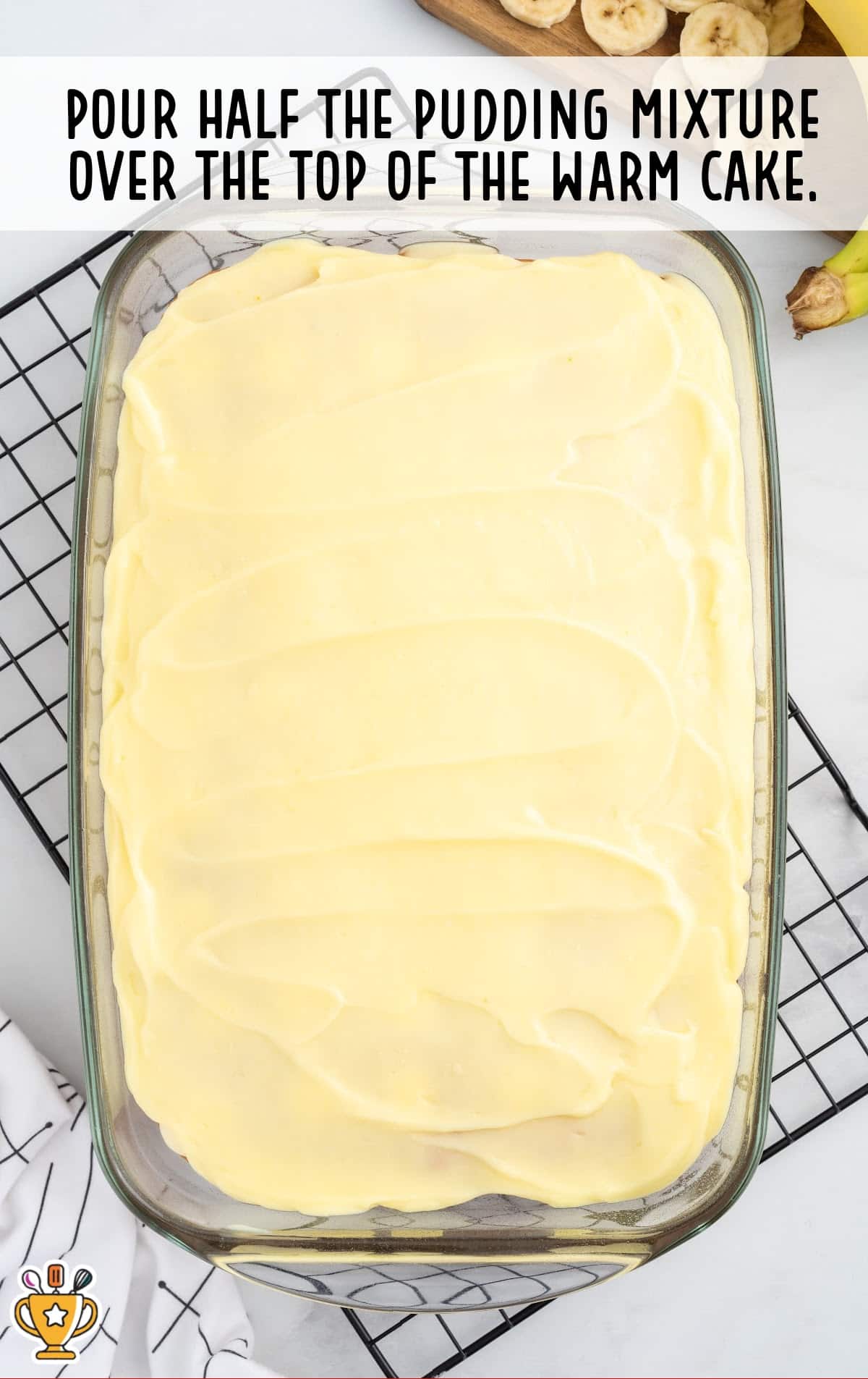pudding mixture poured over the top of the warm cake