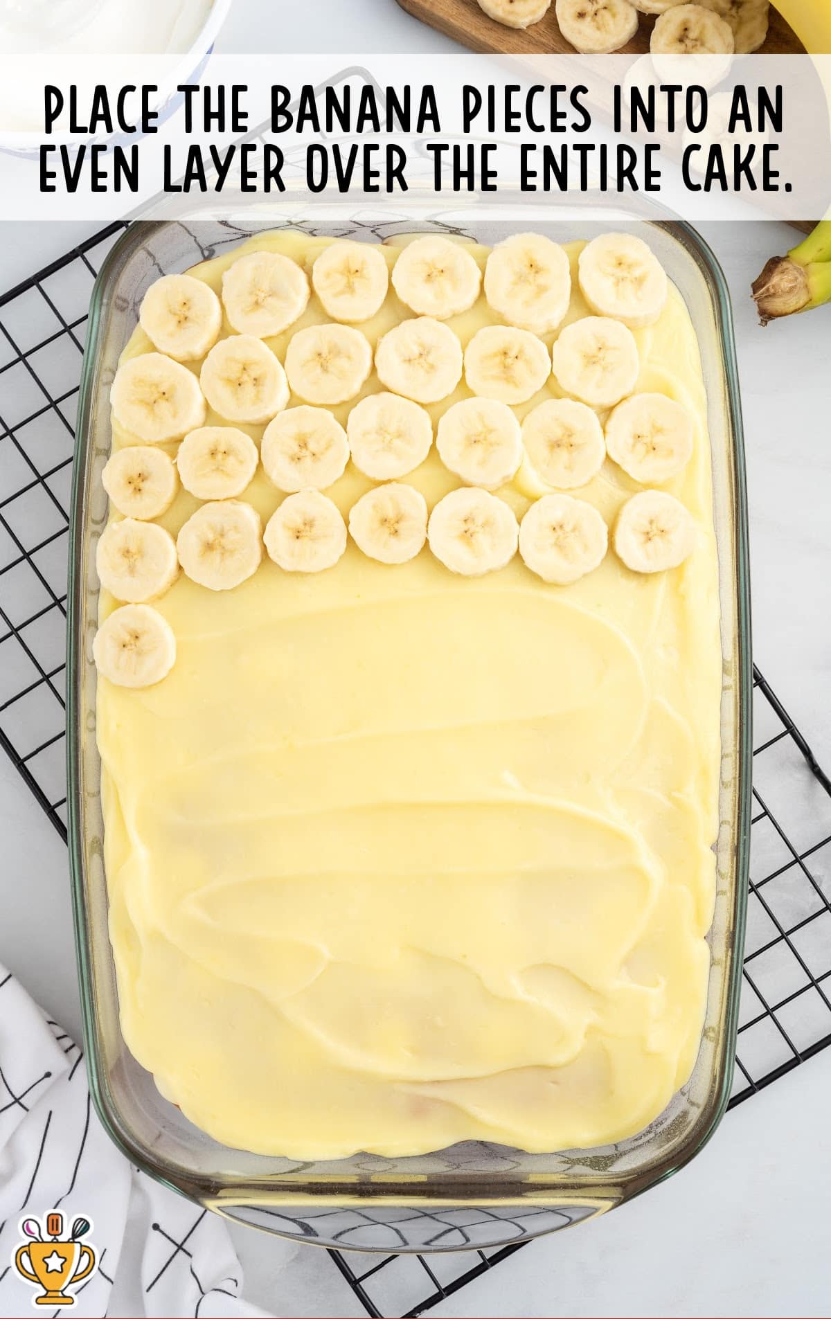 banana pieces placed into even layer over the entire cake