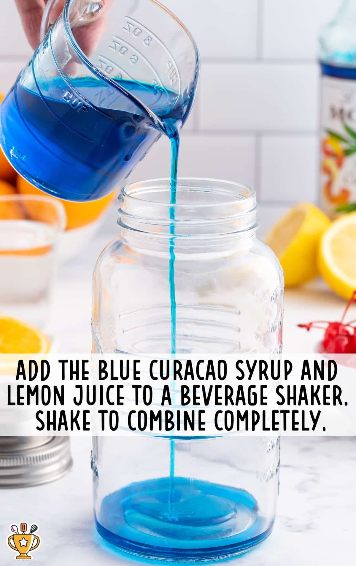 adding blue curacao syrup and lemon juice in a beverage shaker