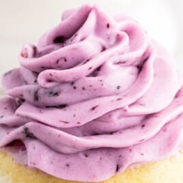 Blueberry Cream Cheese Frosting decorated on top of a cupcake