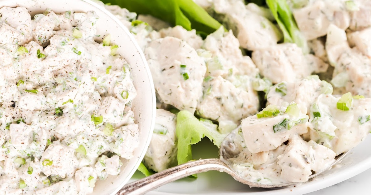Chicken Salad in a bowl and held by a spoon