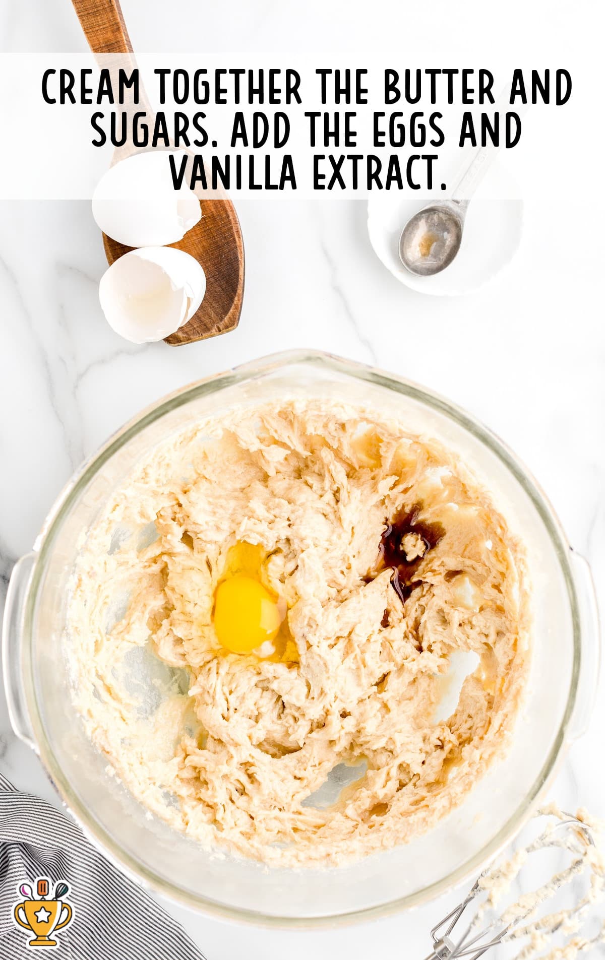 The eggs and sugar are creamed together in a mixing bowl.