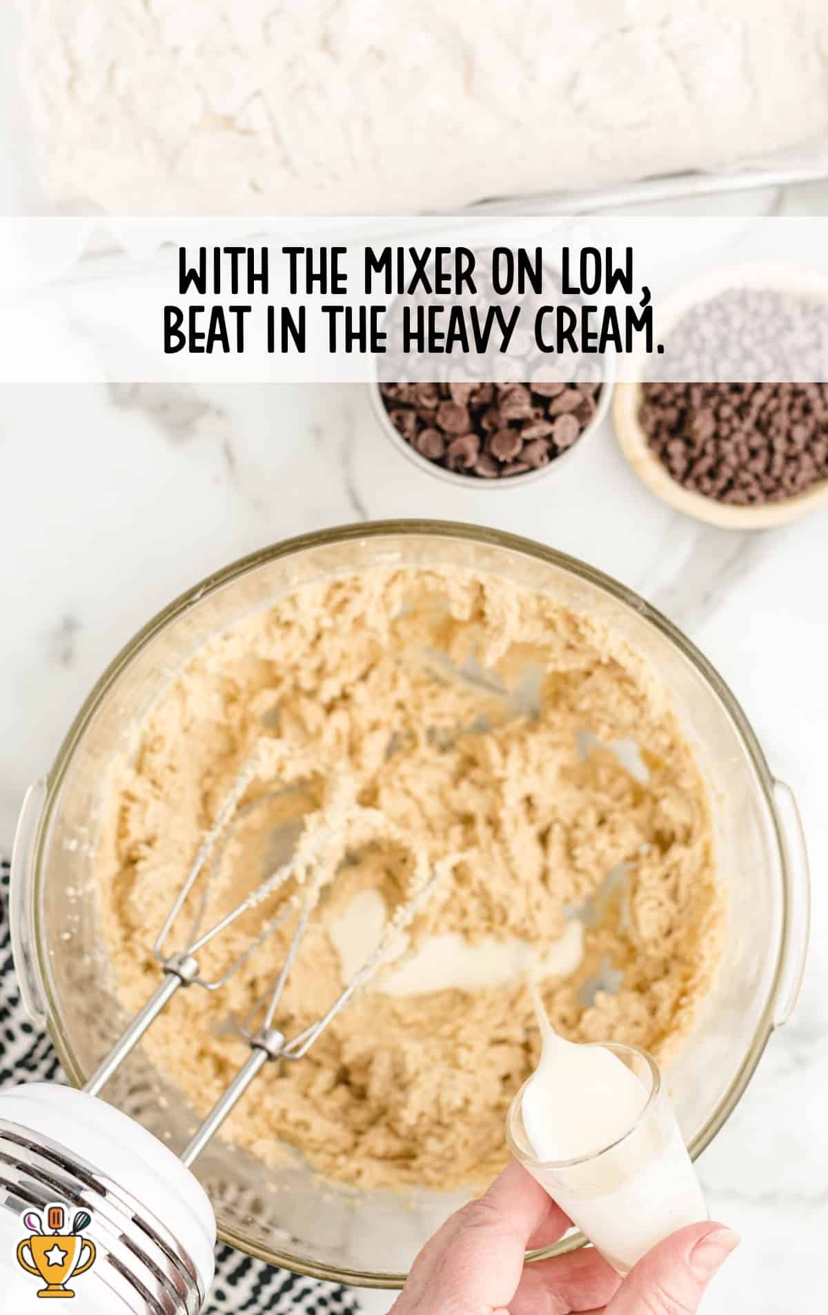 adding heavy cream in a bowl of mixture