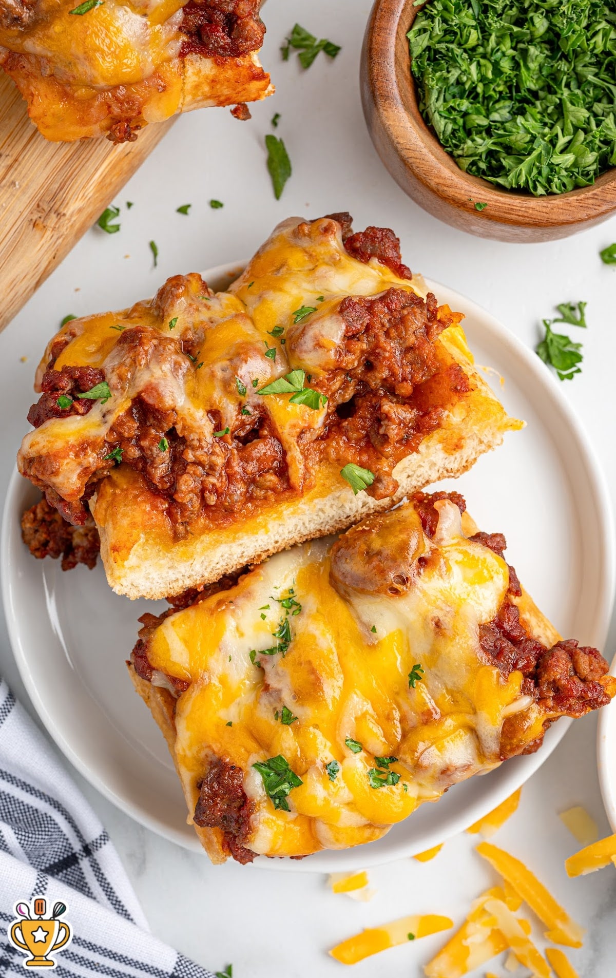 two pieces of Sloppy Joe Garlic Bread on a plate