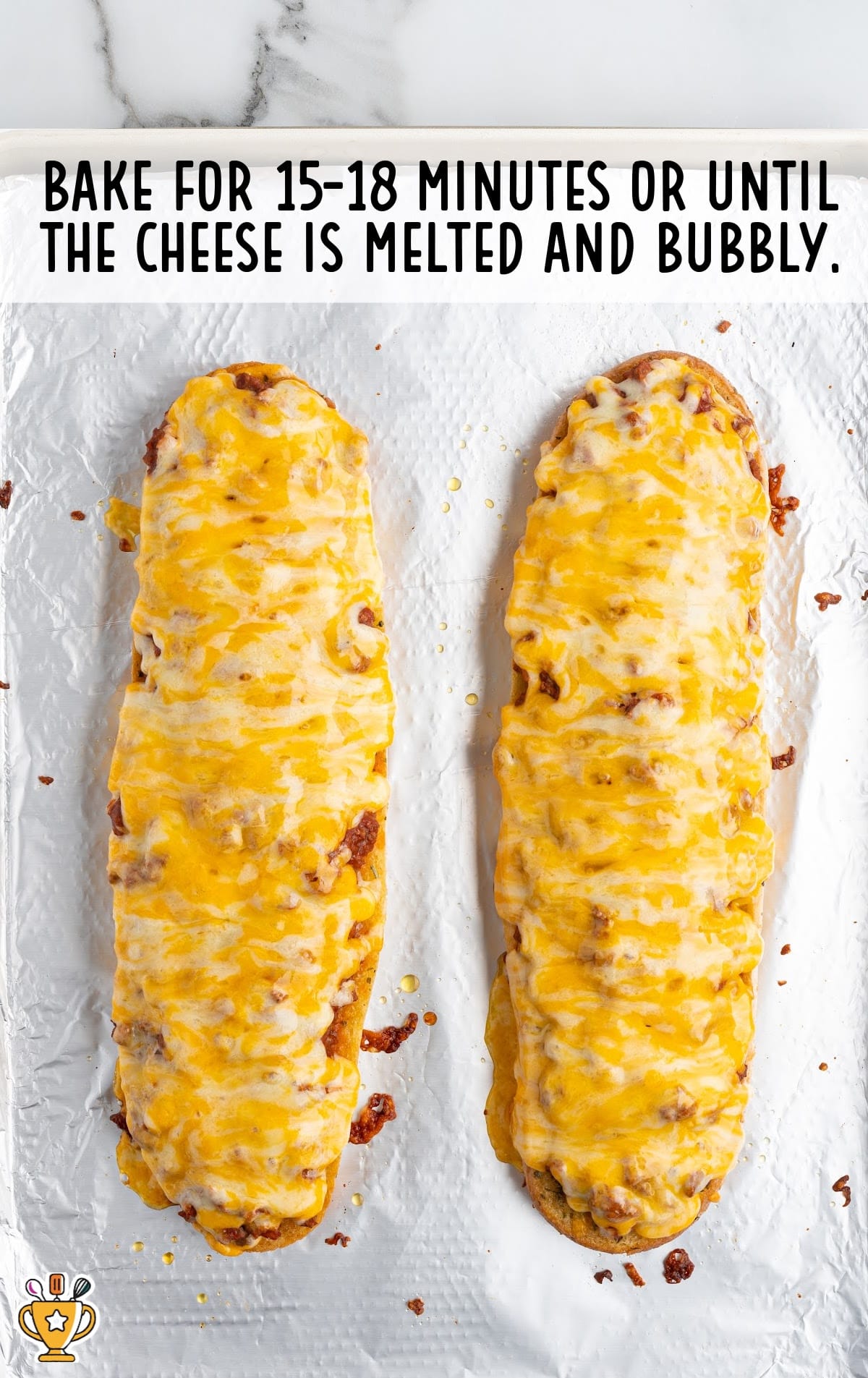 two garlic loafs with melted cheese on top