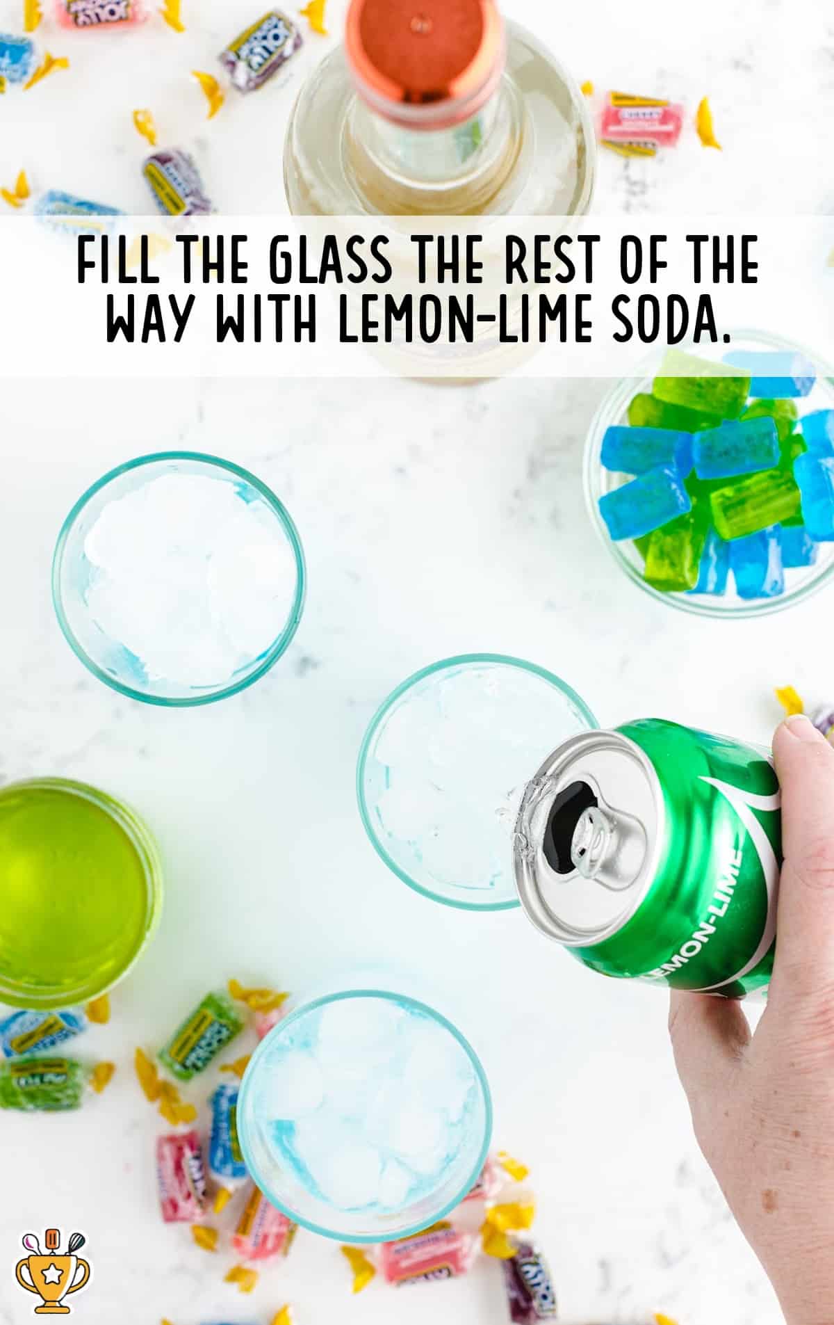 filling the glasses with lemon lime soda