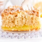 a fork in a piece of Lemon Coffee Cake