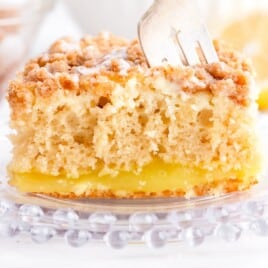 a fork in a piece of Lemon Coffee Cake