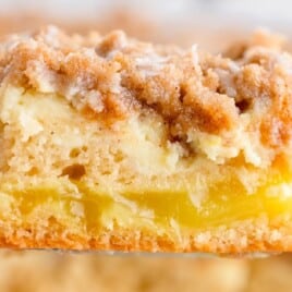 a spatula holding a piece of Lemon Coffee Cake