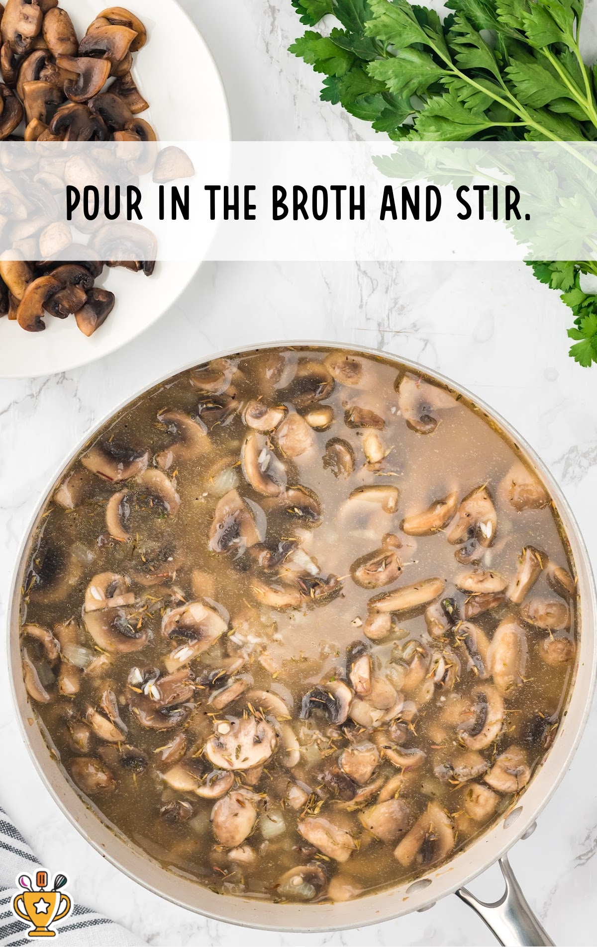 pouring broth in a skillet