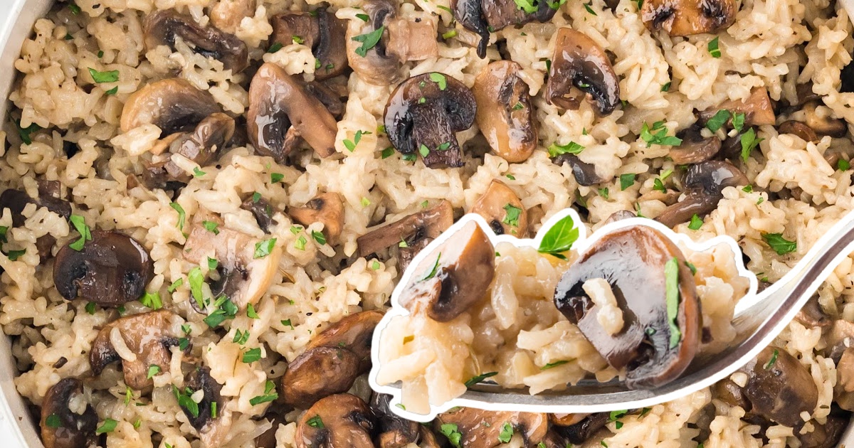 a close up photo of Mushroom Rice with a fork holding some