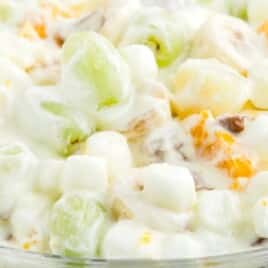 a close up photo of Overnight Fruit Salad in a clear bowl