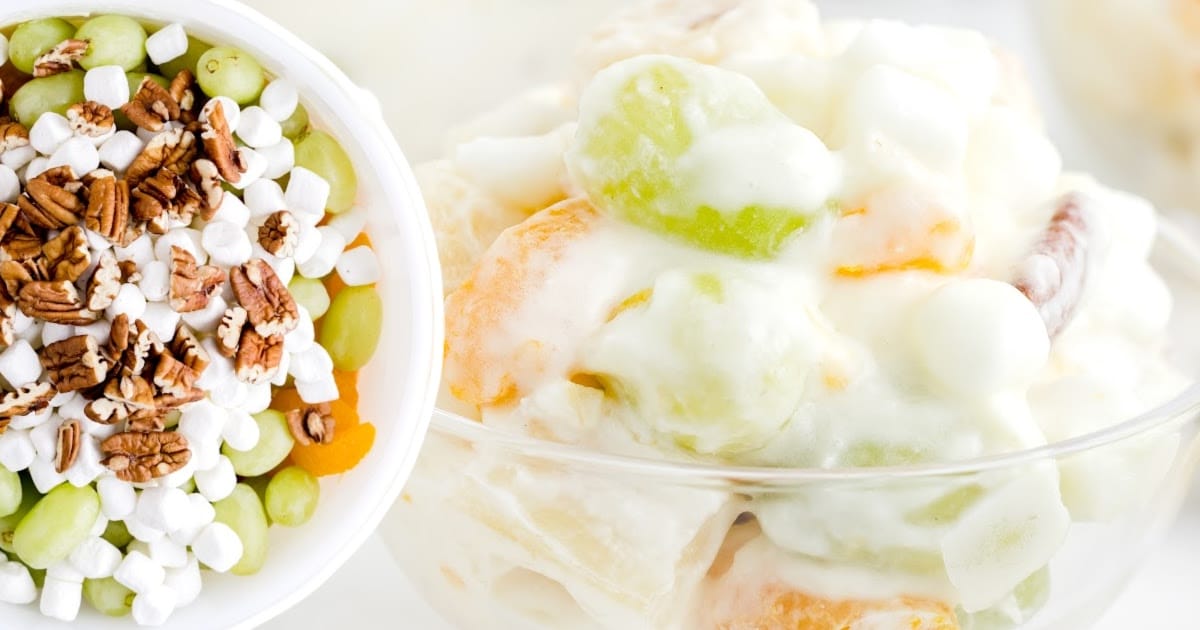 a bowl full of Overnight Fruit Salad and another bowl with ingredients