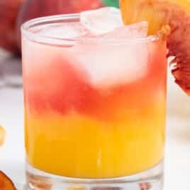 a close up photo of Peach Cocktail in a glass