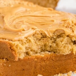 Peanut Butter Quick Bread slices with a bite on it