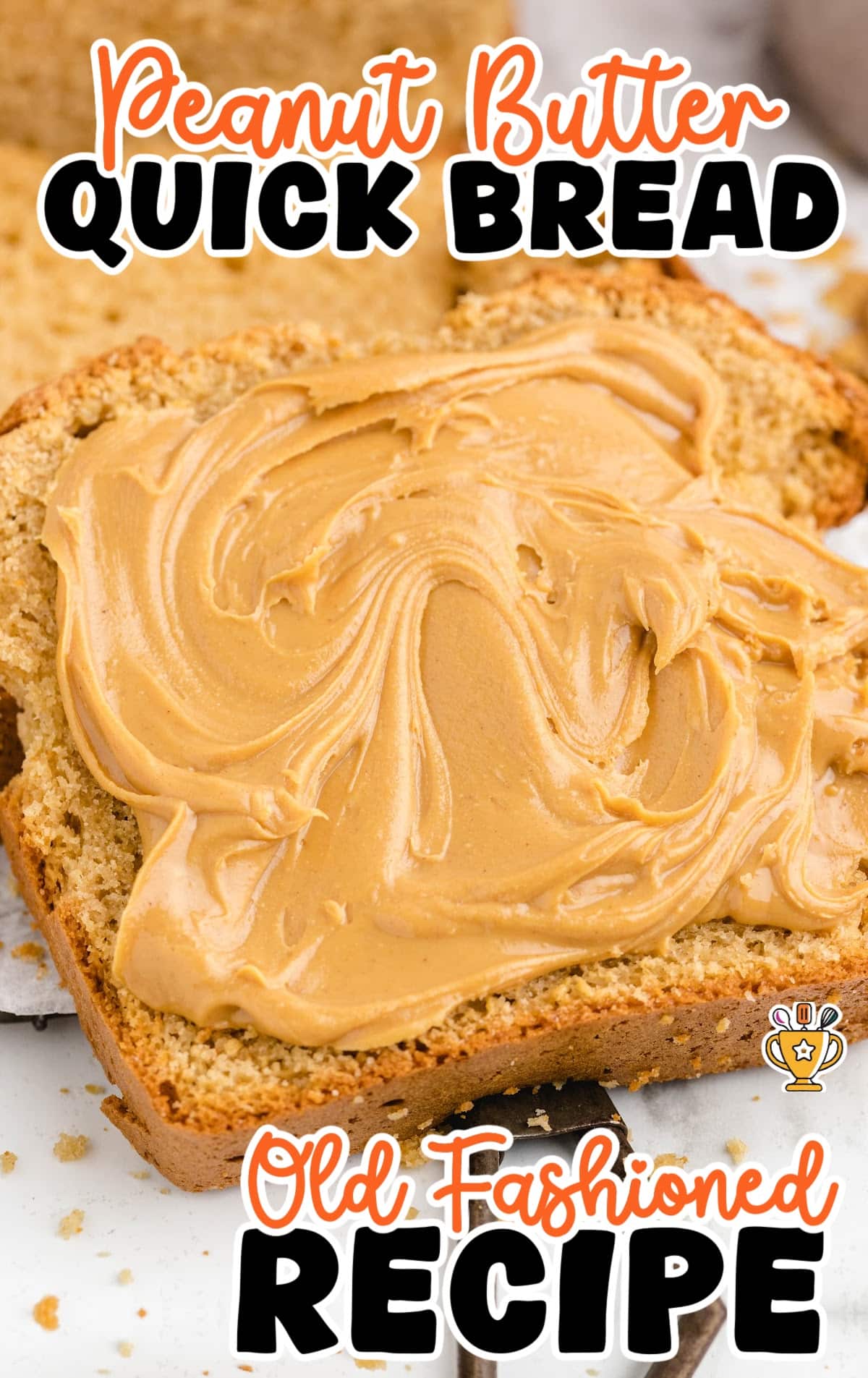 a slice of Peanut Butter Quick Bread with some peanut butter on it