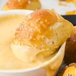 dipping a Pretzel Bite with Cheese in a bowl