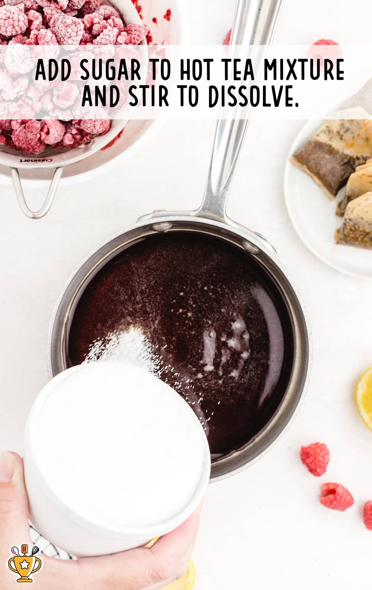 sugar added to hot tea mixture