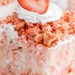 a piece of Strawberry Crunch Poke Cake on a plate